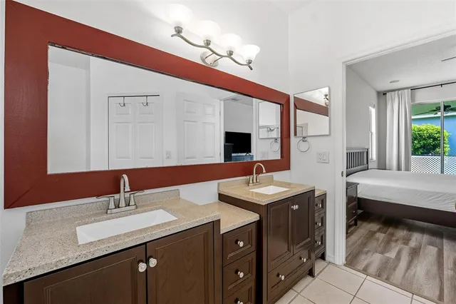 a living room with couch and a ceiling fan