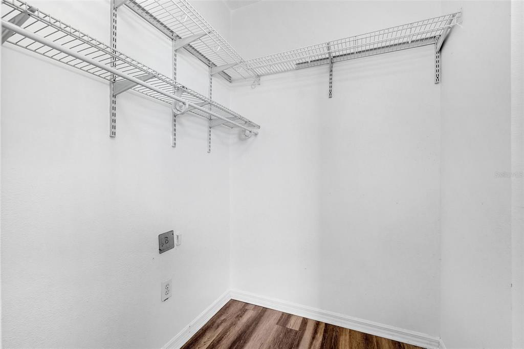 10443 Peppergrass Court Trinity, FL 34655 - Photo 31 of 62 a view of a room with racks on the wall