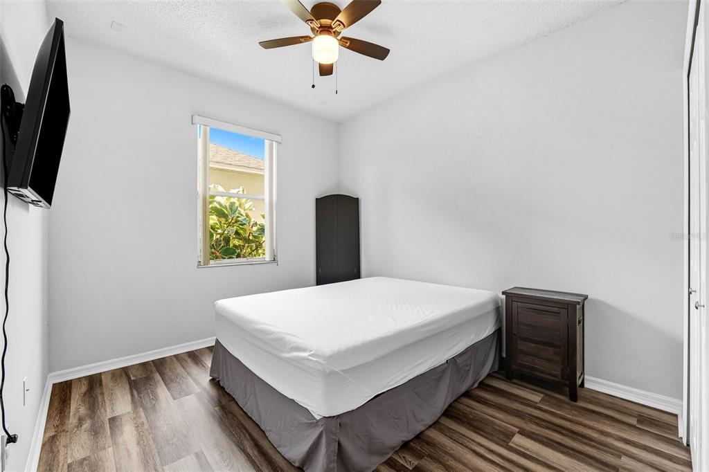 10443 Peppergrass Court Trinity, FL 34655 - Photo 38 of 62 a bed room with a bed and a window