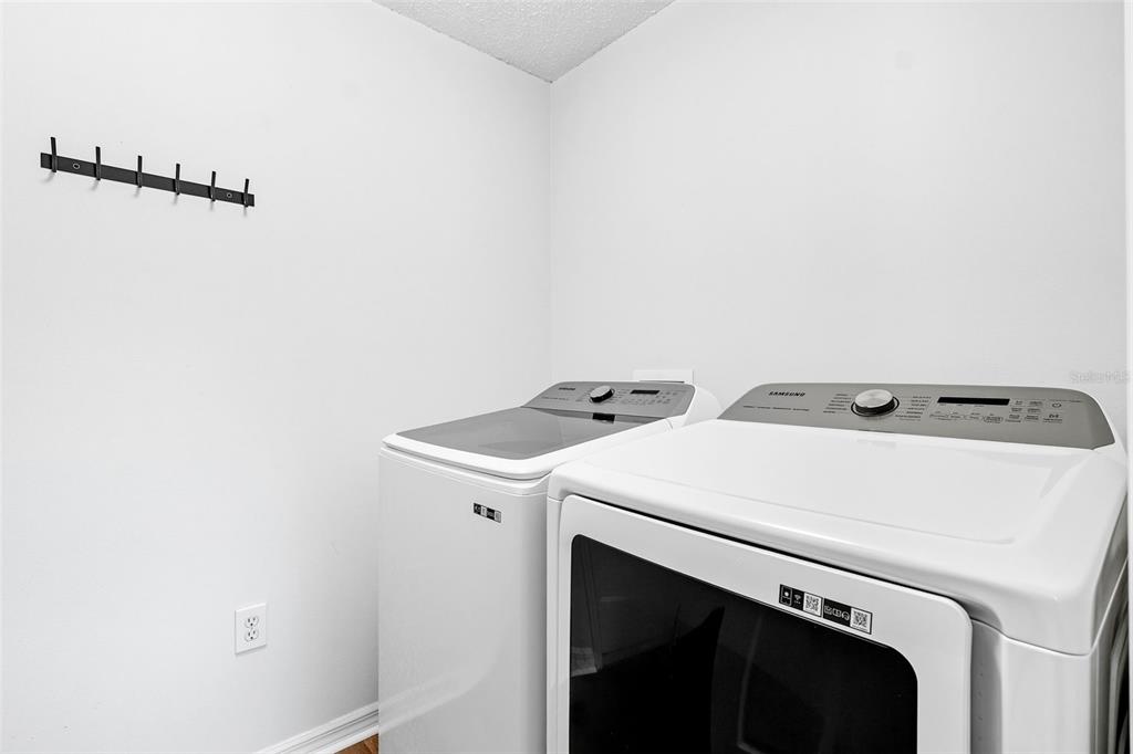 10443 Peppergrass Court Trinity, FL 34655 - Photo 42 of 62 a utility room with dryer and washer