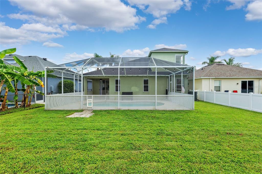 10443 Peppergrass Court Trinity, FL 34655 - Photo 49 of 62 a view of house with a big yard and potted plants