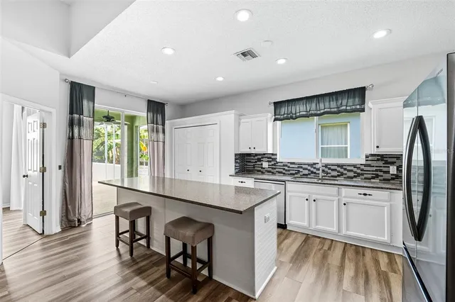 a view of entryway with wooden floor