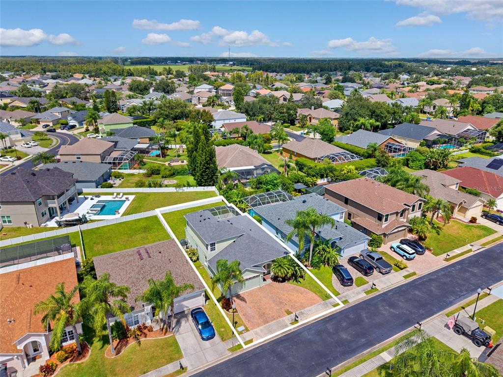 10443 Peppergrass Court Trinity, FL 34655 - Photo 62 of 62 an aerial view of residential houses with outdoor space and a lake view