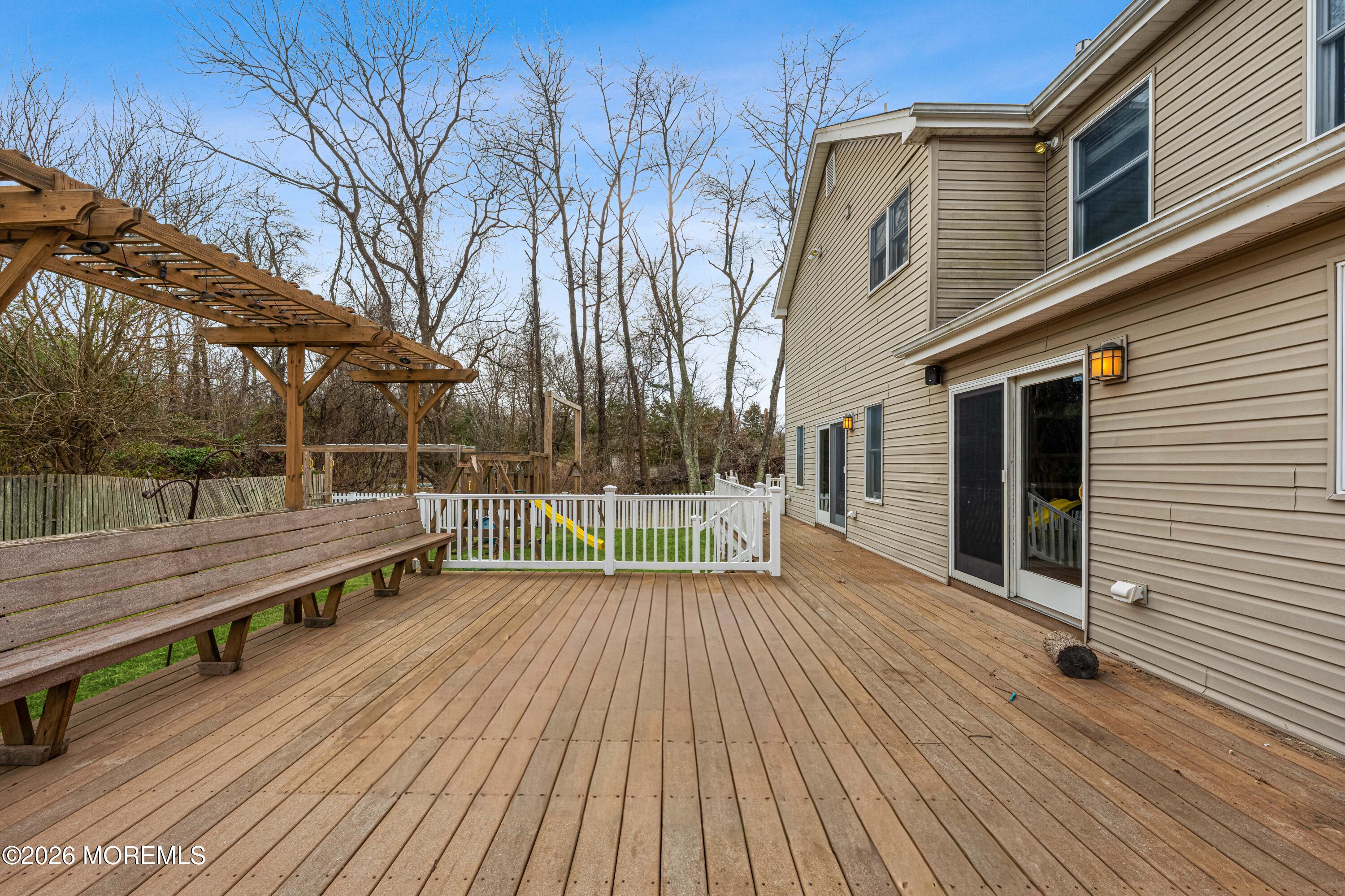 1 Kari Court Jackson, NJ 08527 - Photo 15 of 66 a view of a wooden deck with a yard
