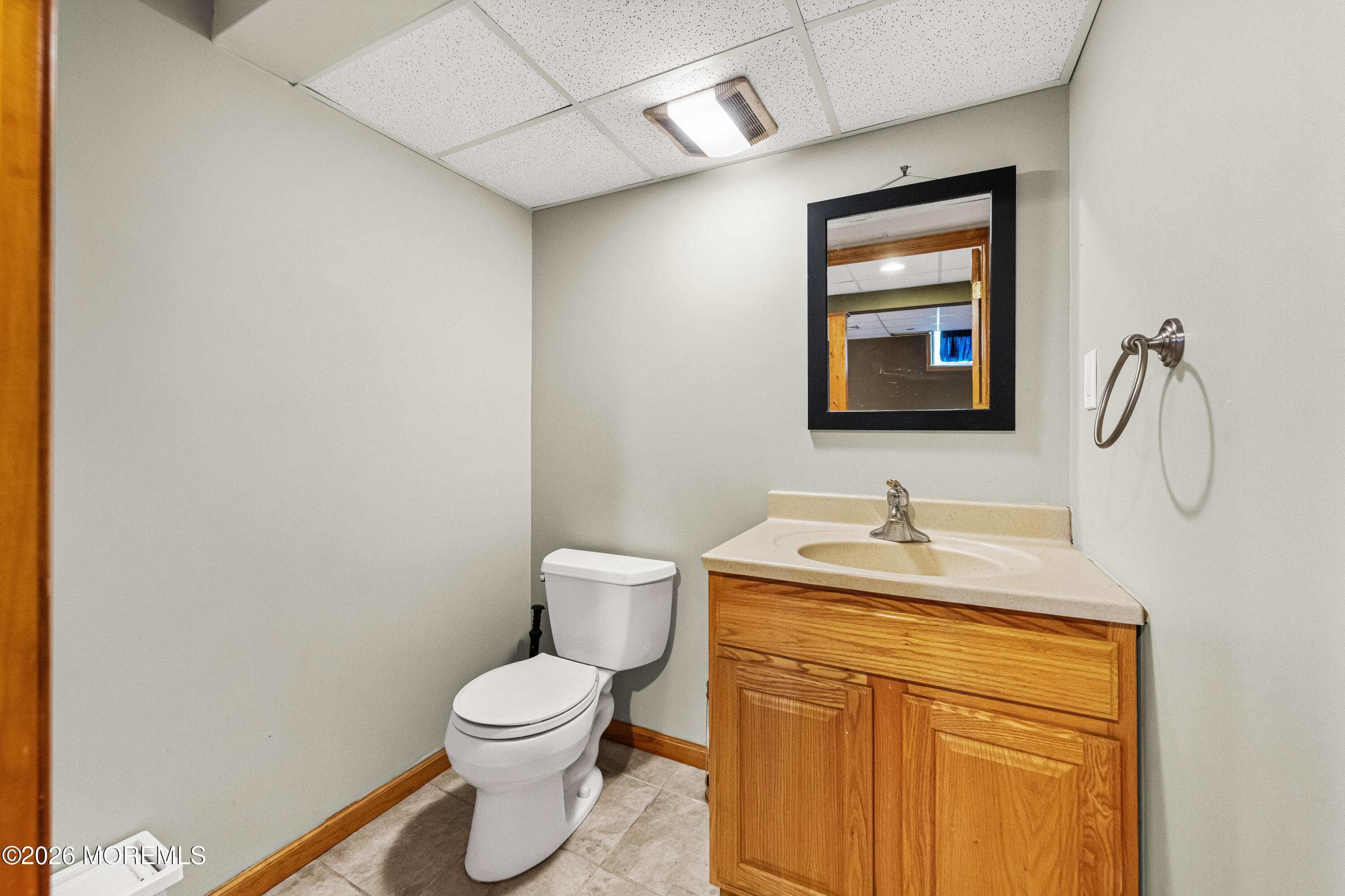 1 Kari Court Jackson, NJ 08527 - Photo 26 of 66 a bathroom with a granite countertop toilet sink and mirror