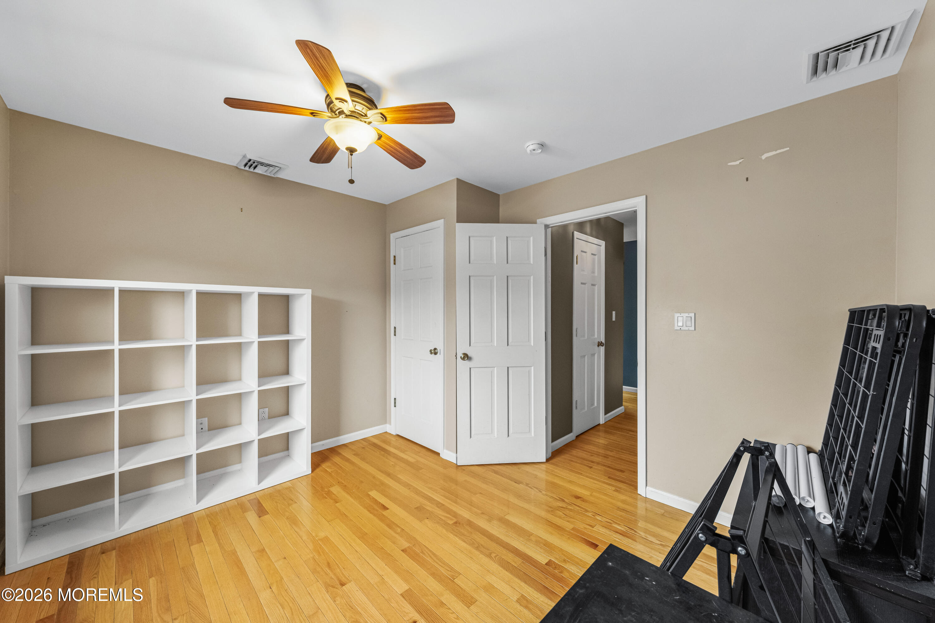 1 Kari Court Jackson, NJ 08527 - Photo 33 of 66 a bedroom with a bed and a chandelier