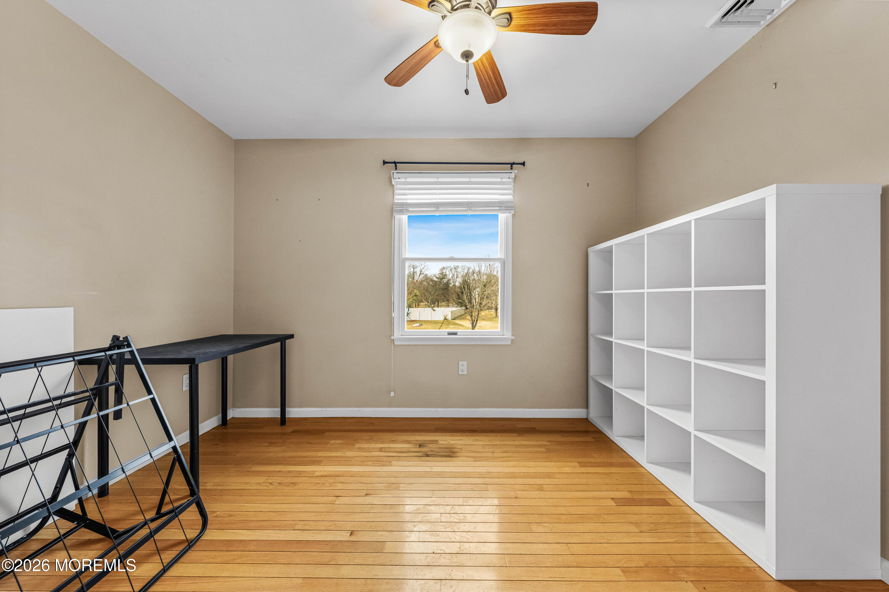 1 Kari Court Jackson, NJ 08527 - Photo 34 of 66 a view of an empty room with wooden floor and a window