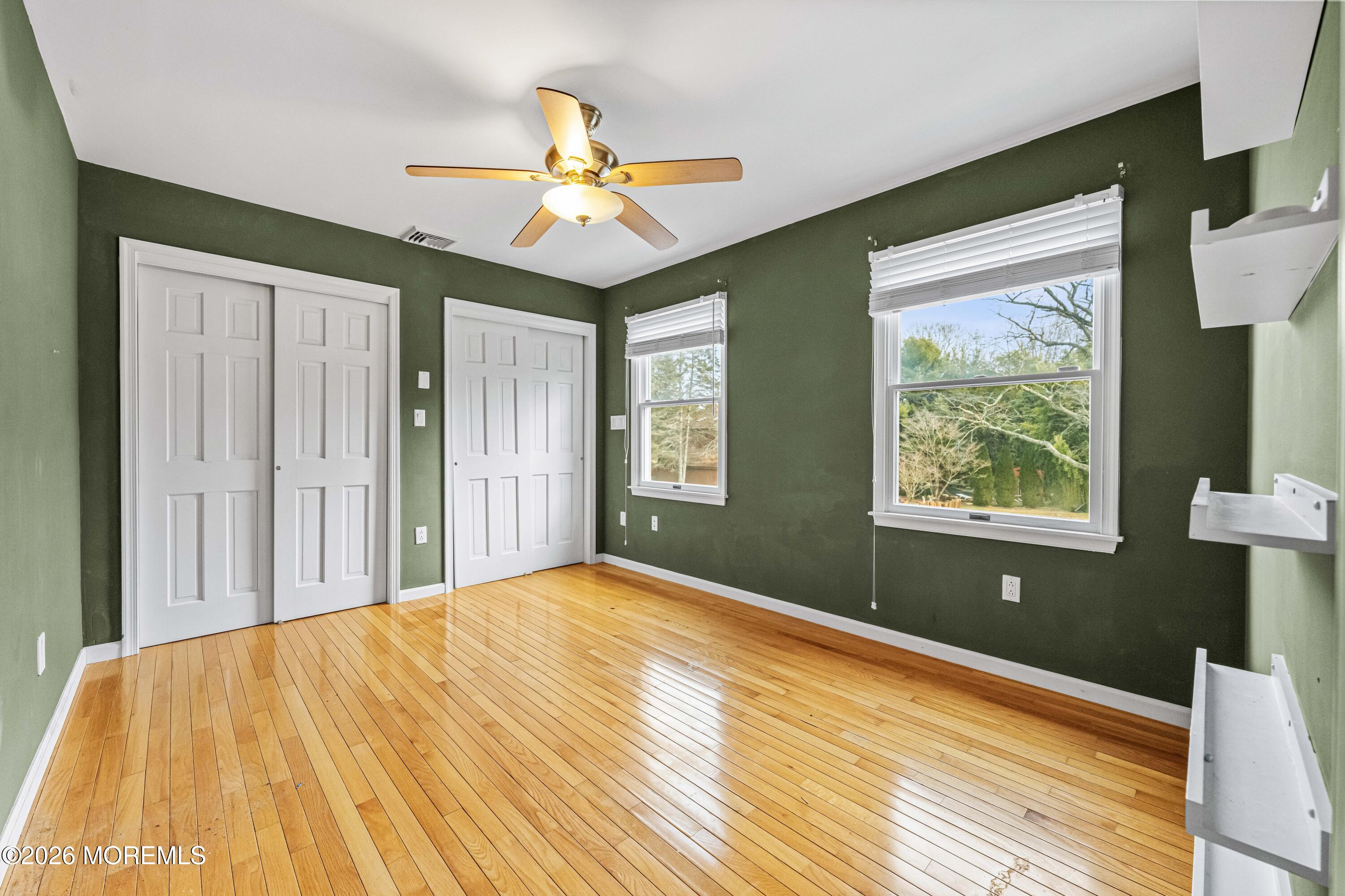 1 Kari Court Jackson, NJ 08527 - Photo 38 of 66 a bedroom with a bed and a chandelier