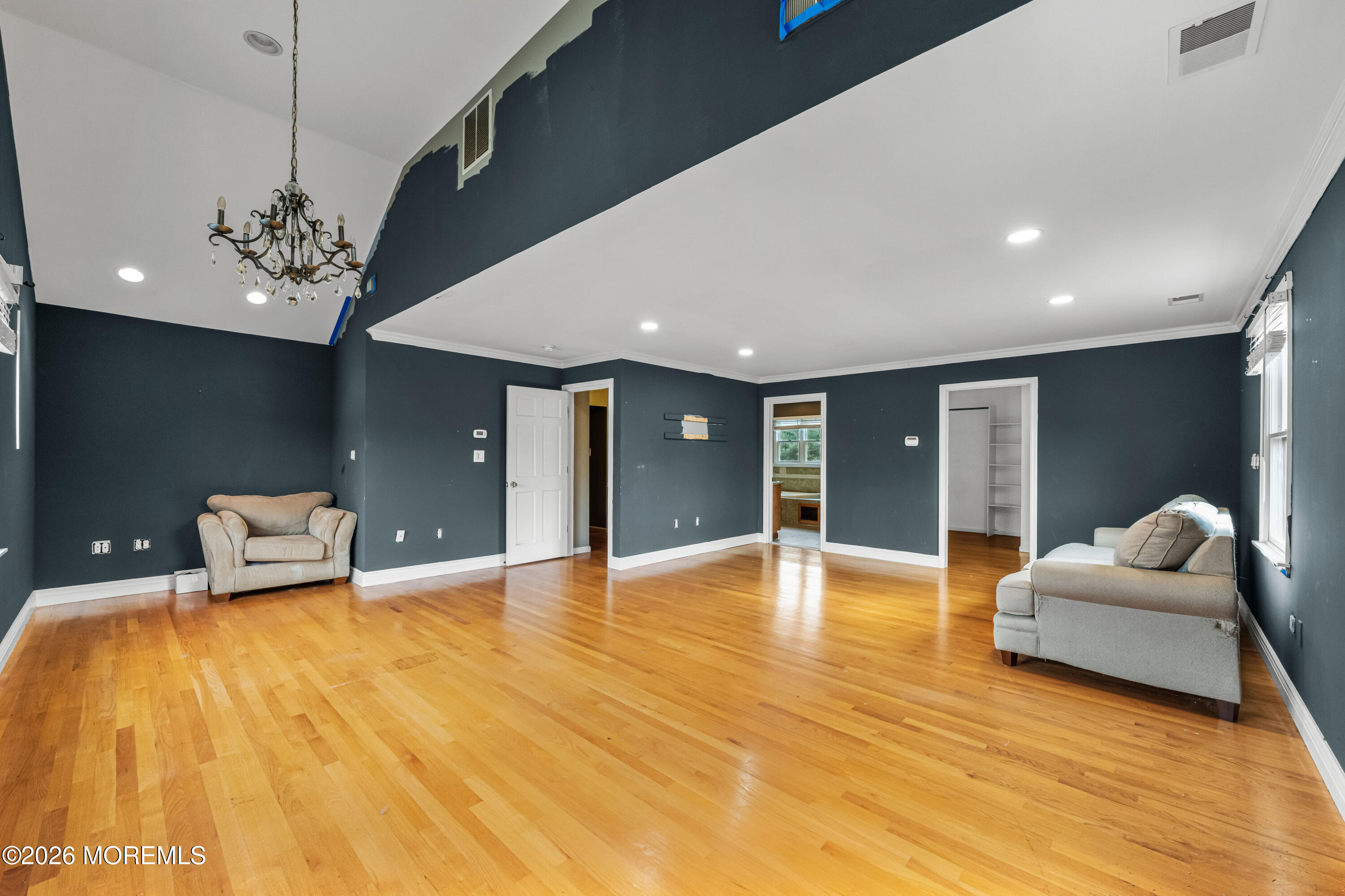 1 Kari Court Jackson, NJ 08527 - Photo 42 of 66 a big room with wooden floor and chandelier