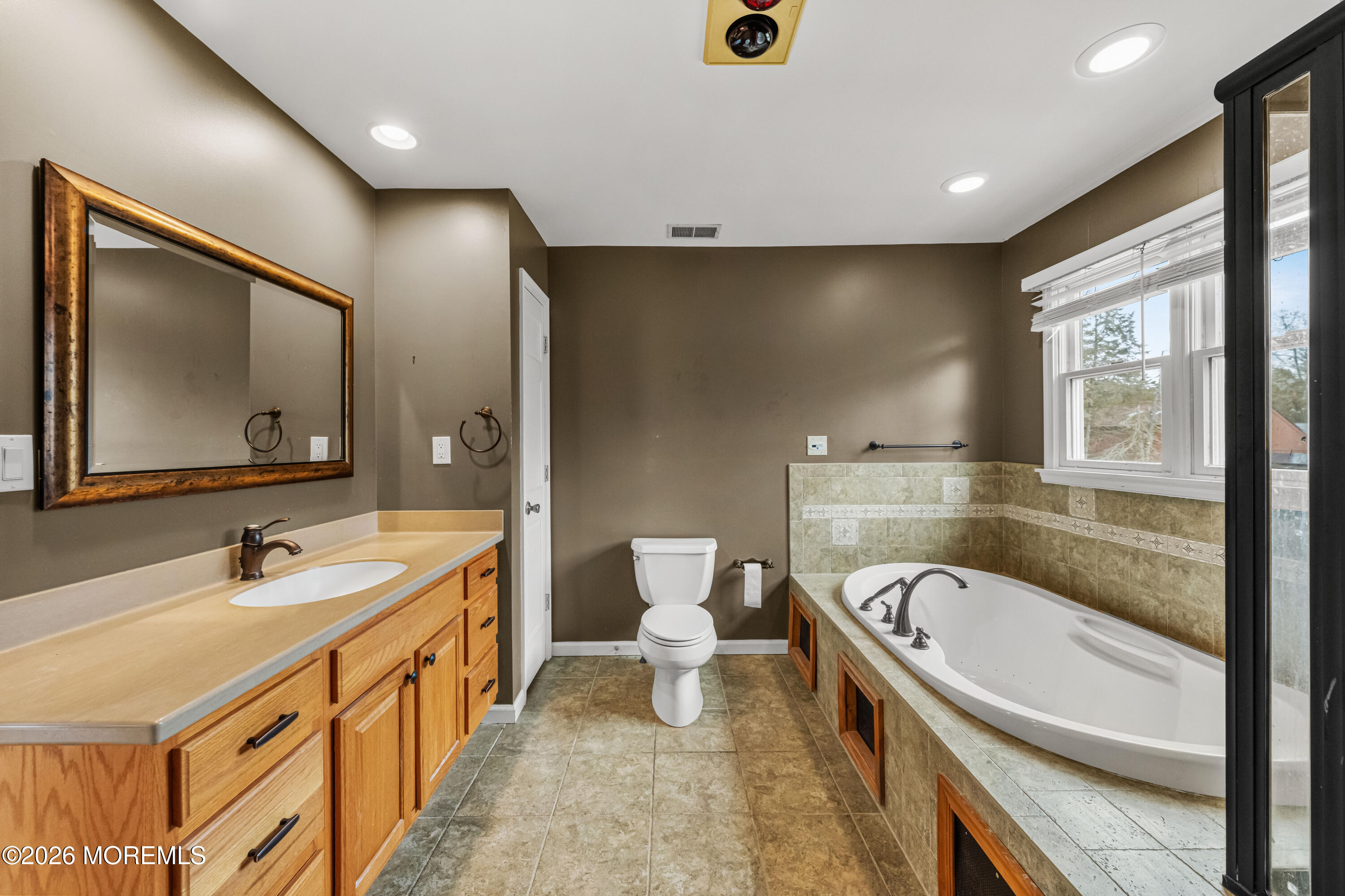1 Kari Court Jackson, NJ 08527 - Photo 46 of 66 a bathroom with a sink a toilet and a large mirror