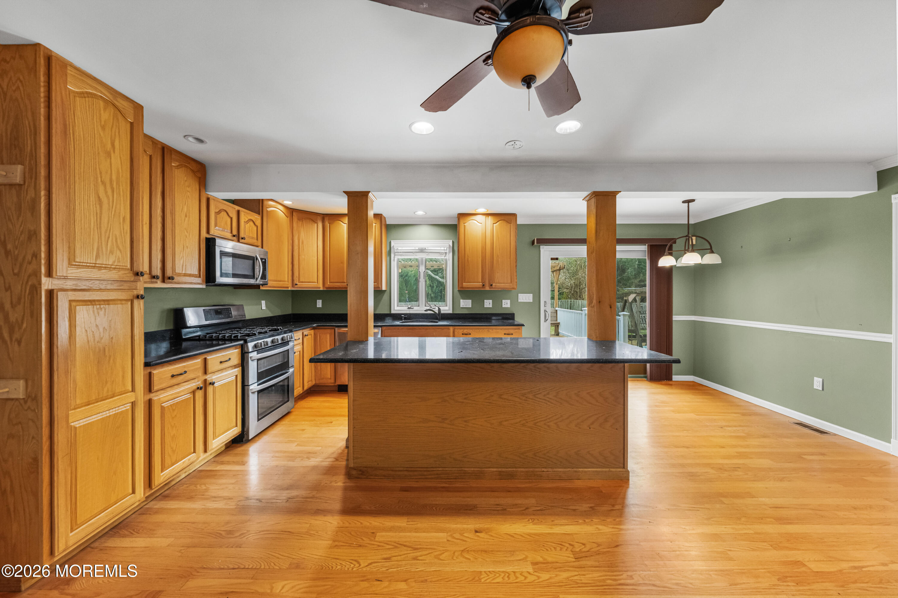 1 Kari Court Jackson, NJ 08527 - Photo 57 of 66 a kitchen with stainless steel appliances granite countertop a stove a sink and a microwave