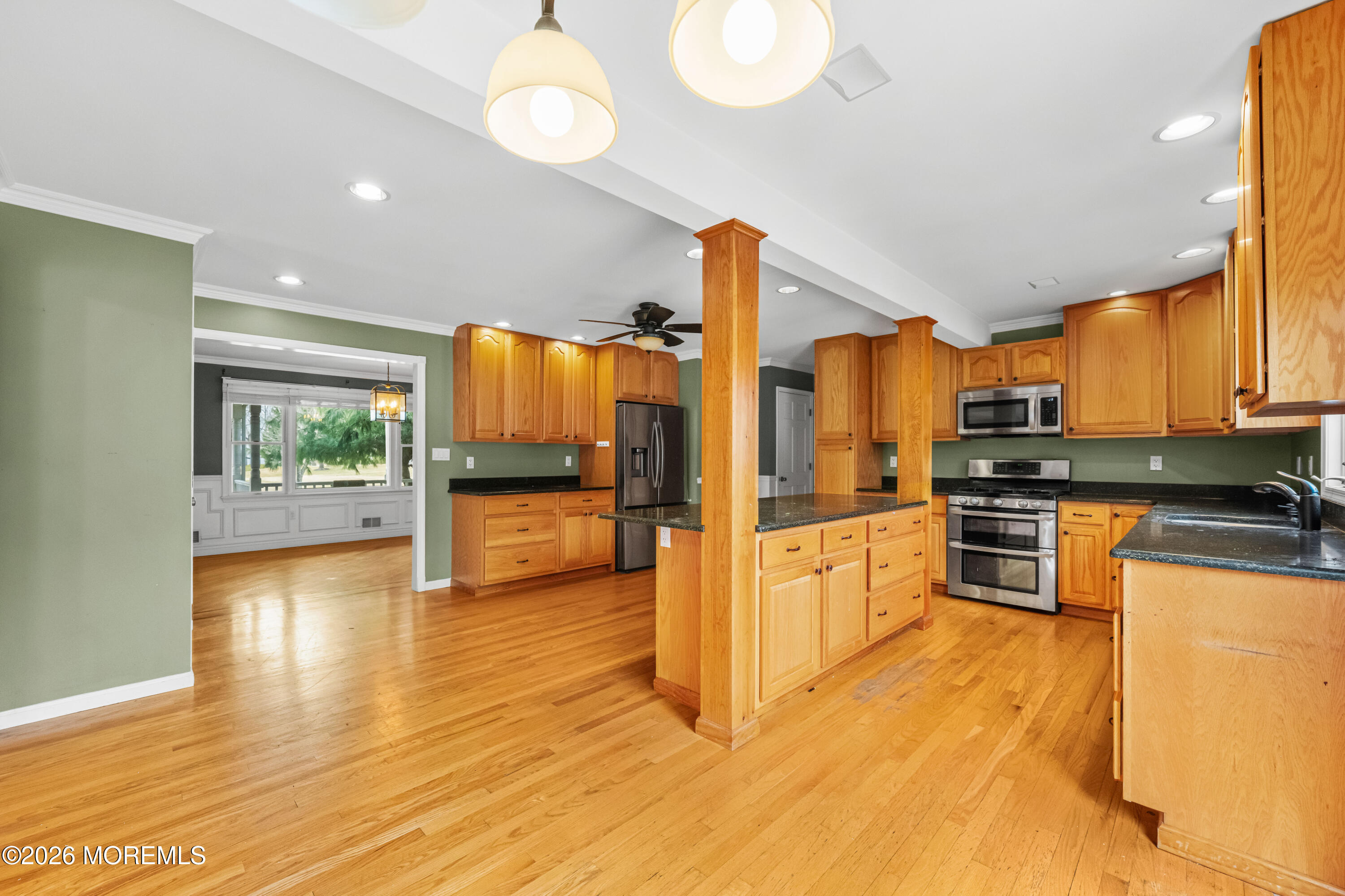 1 Kari Court Jackson, NJ 08527 - Photo 58 of 66 a kitchen with stainless steel appliances wooden floor and large windows
