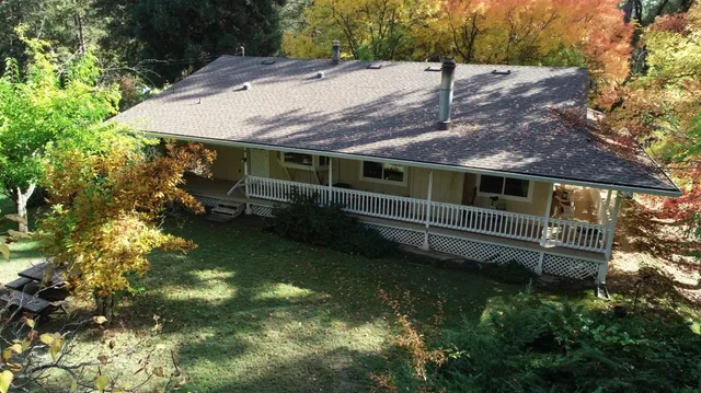 a backyard of a house with lots of green space