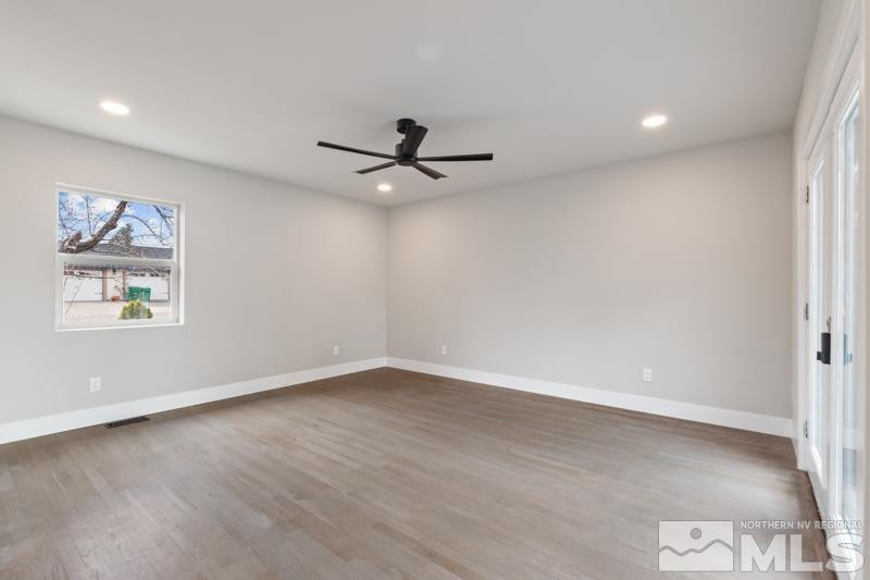 995 Skyline Boulevard Reno, NV 89509 - Photo 17 of 34 an empty room with a window and a ceiling fan