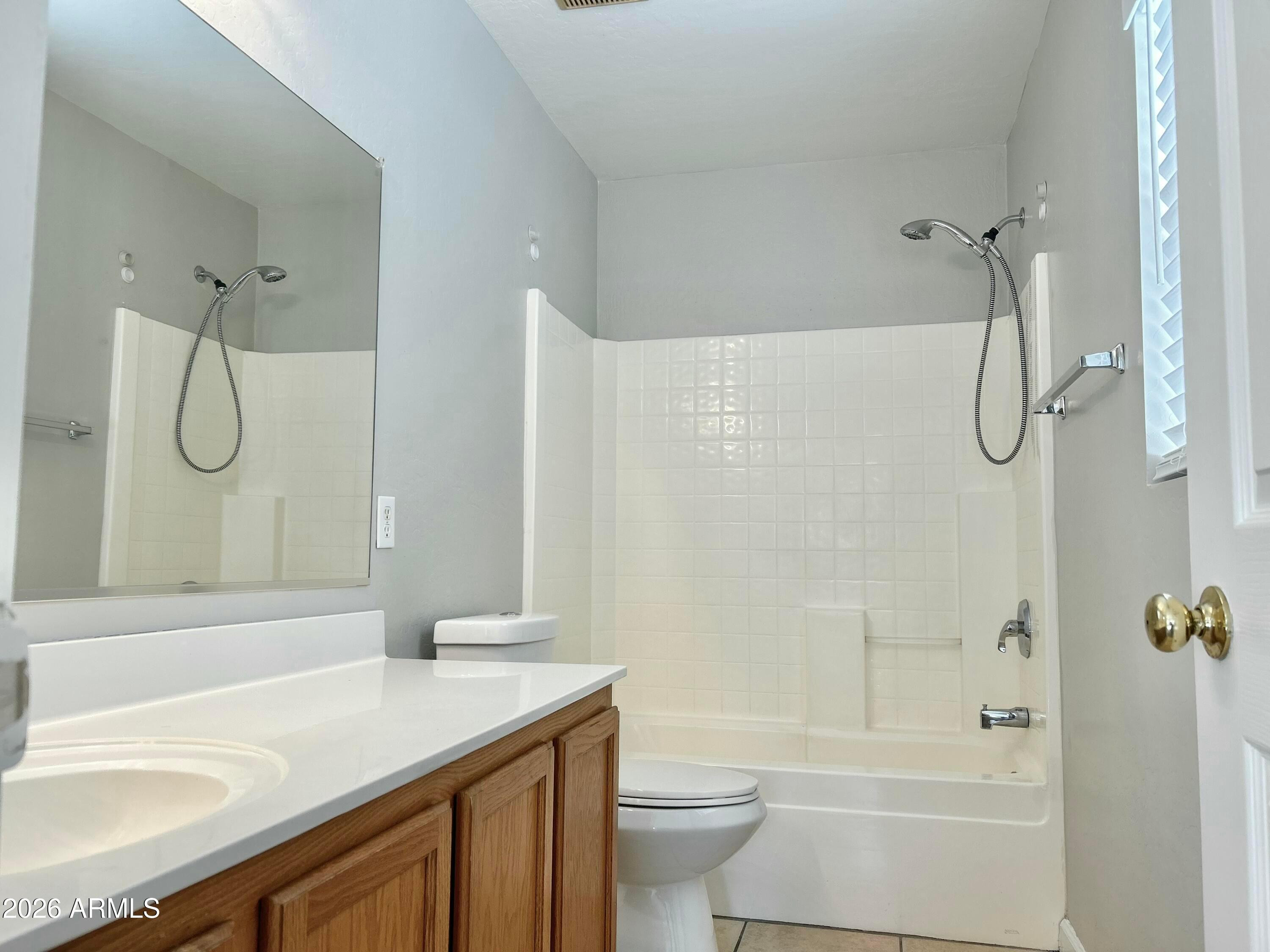 2701 East Bagdad Road San Tan Valley, AZ 85143 - Photo 13 of 21 a bathroom with a granite countertop sink a toilet and shower