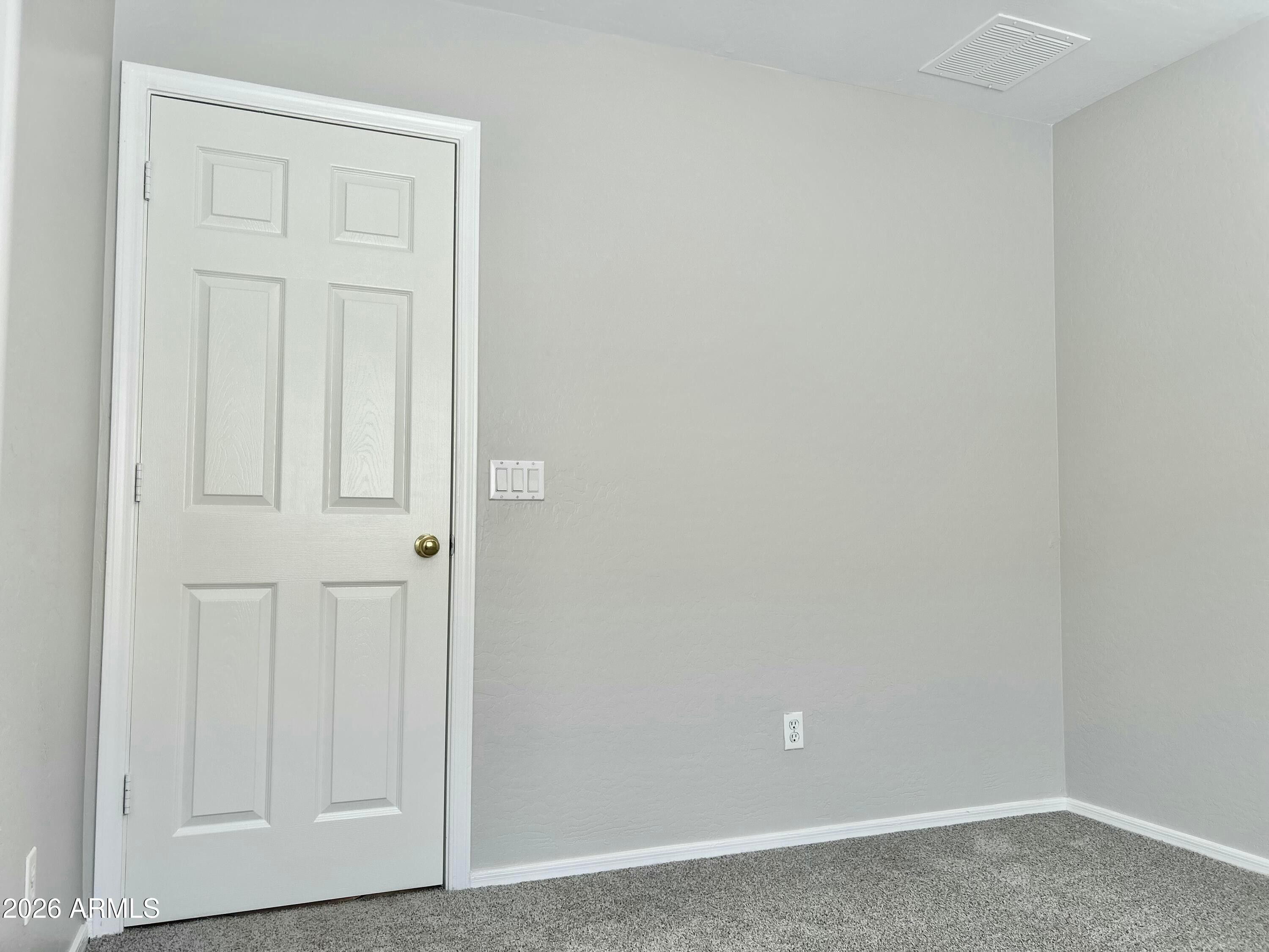 2701 East Bagdad Road San Tan Valley, AZ 85143 - Photo 15 of 21 an empty room with wooden floor