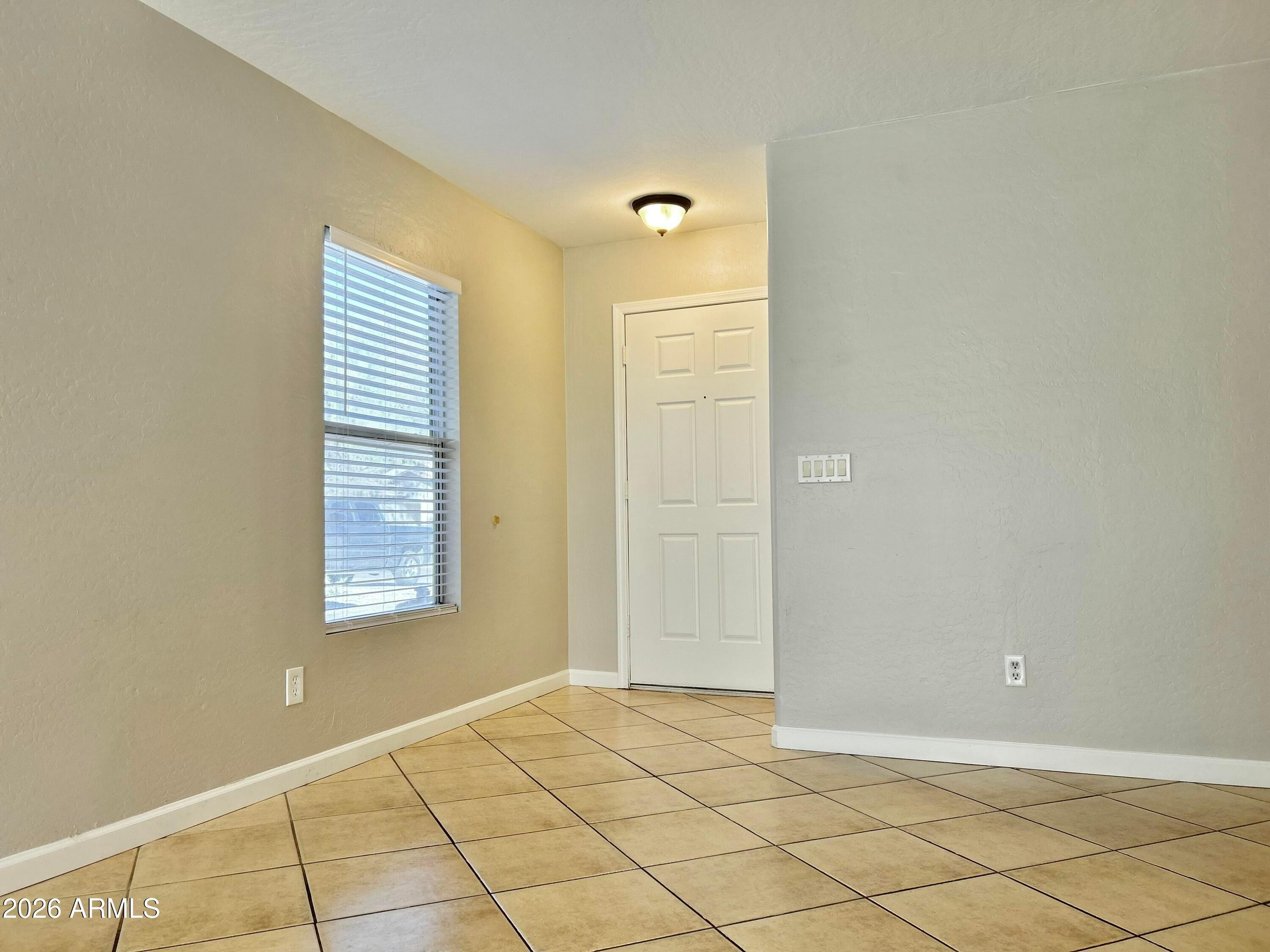 2701 East Bagdad Road San Tan Valley, AZ 85143 - Photo 4 of 21 a view of an empty room and window