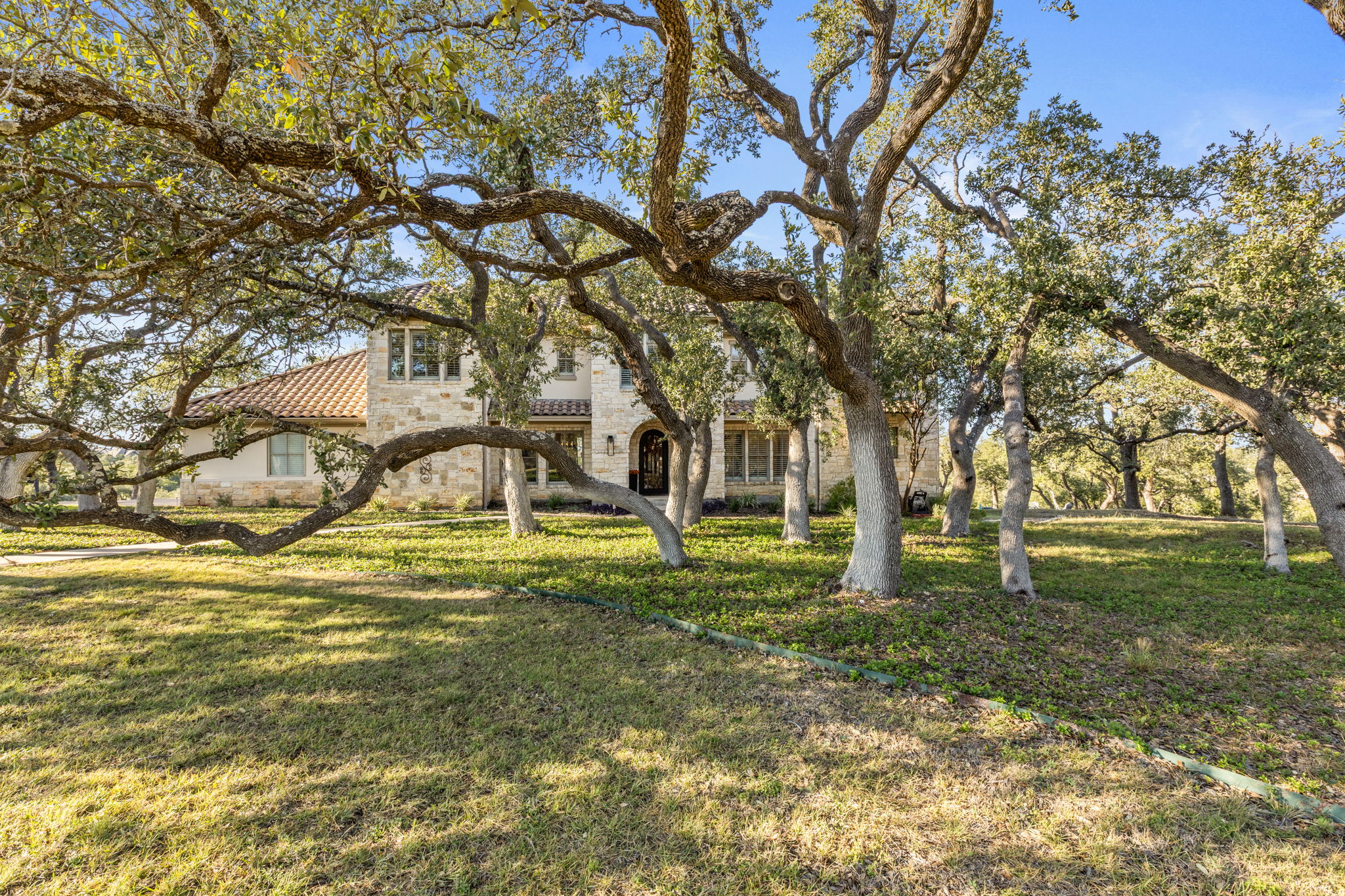 447 Winning Colors Austin, TX 78737 - Photo 4 of 40 This property is dotted with many heritage oaks and plenty of room to enjoy as is or develop further