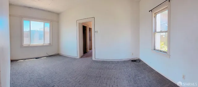 a view of an empty room with a window