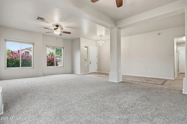 a view of a big room with windows and cabinet