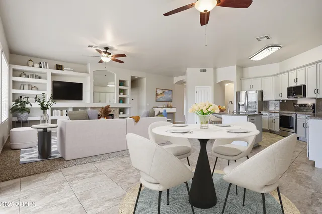 a living room with fireplace furniture and a flat screen tv