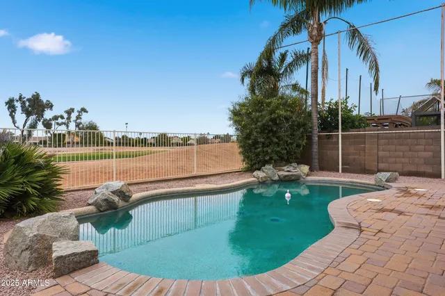 a view of a swimming pool with a patio