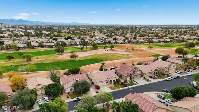 an aerial view of a city with a lake view