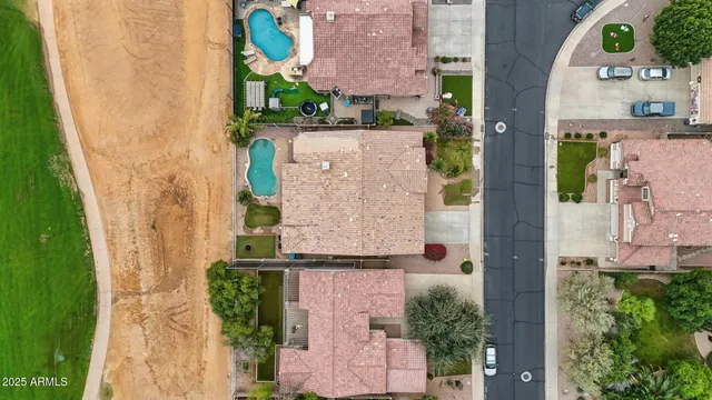 an aerial view of residential houses with outdoor space