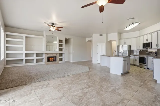 a view of kitchen with furniture and appliances