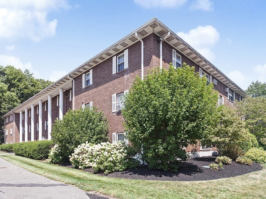 424 Great Road, Unit 15 Acton, MA 01720 - Photo 1 of 9 a front view of a house with garden