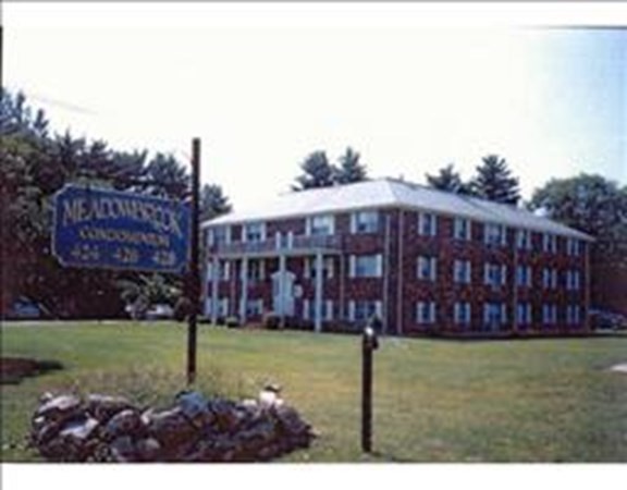 424 Great Road, Unit 15 Acton, MA 01720 - Photo 2 of 9 a view of a yard with a garden