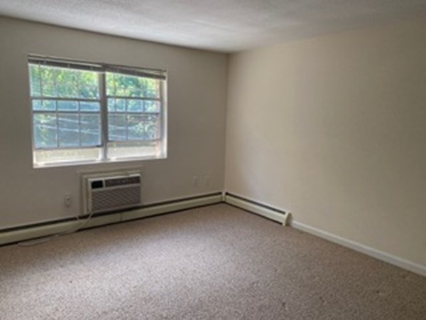 424 Great Road, Unit 15 Acton, MA 01720 - Photo 7 of 9 an empty room with a window