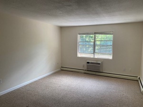 424 Great Road, Unit 15 Acton, MA 01720 - Photo 8 of 9 an empty room with a window