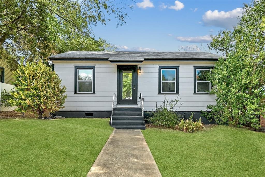 2943 Higgins Street Austin, TX 78722 - Photo 1 of 21 a front view of a house with a garden