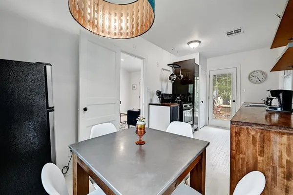 a living room with dining table