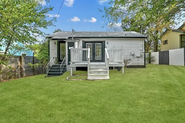 a view of a house with backyard porch and sitting area