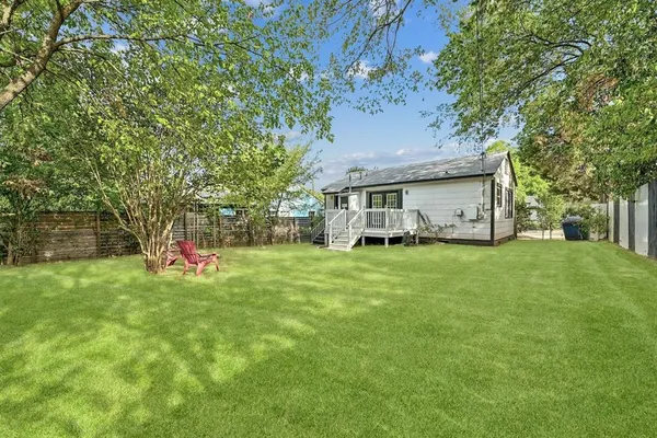 a view of a house with a back yard