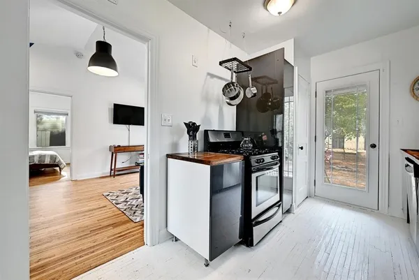 a kitchen with stainless steel appliances granite countertop a stove and a refrigerator