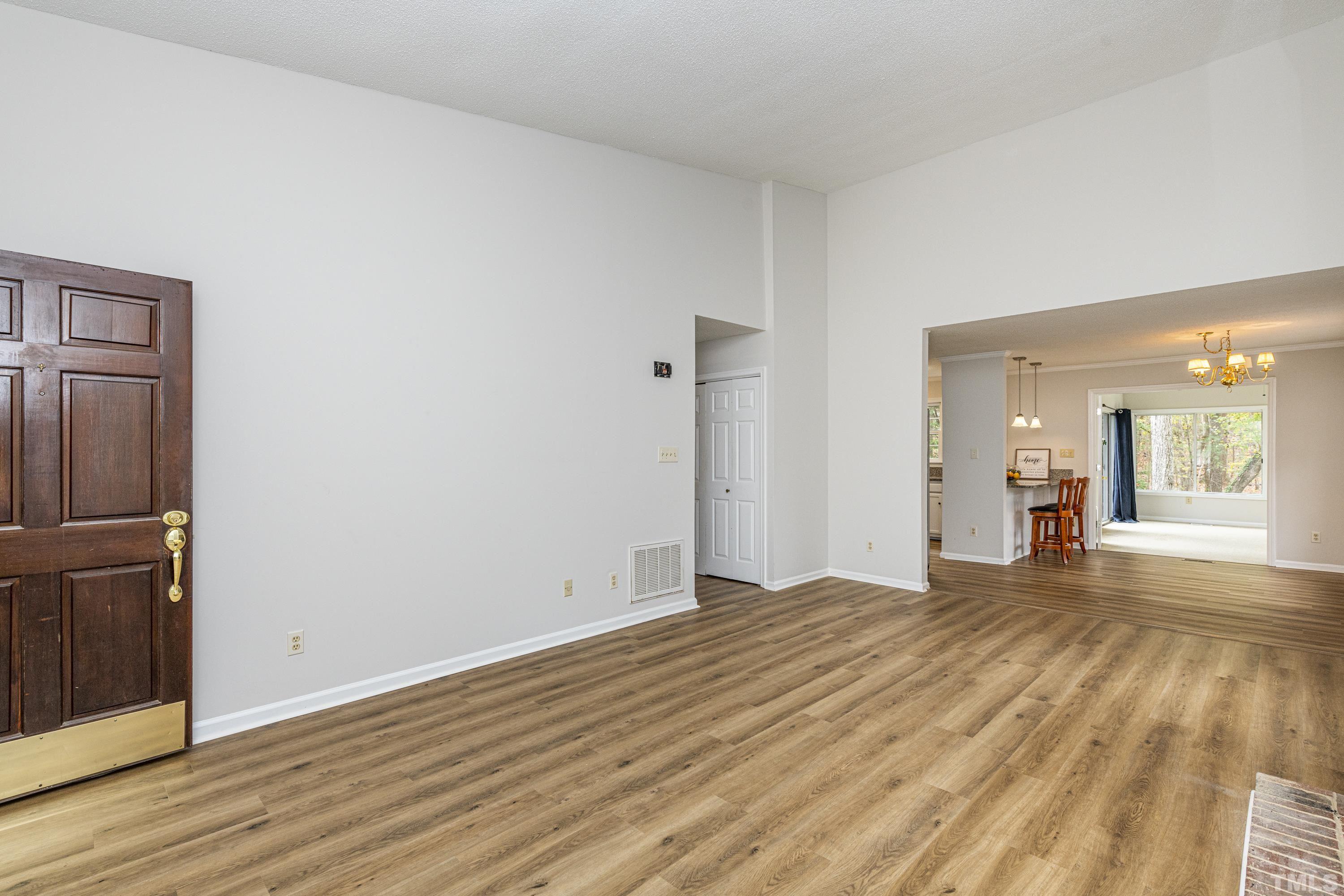 11913 North Exeter Way Raleigh, NC 27613 - Photo 13 of 29 a view of a room with wooden floor and a sink