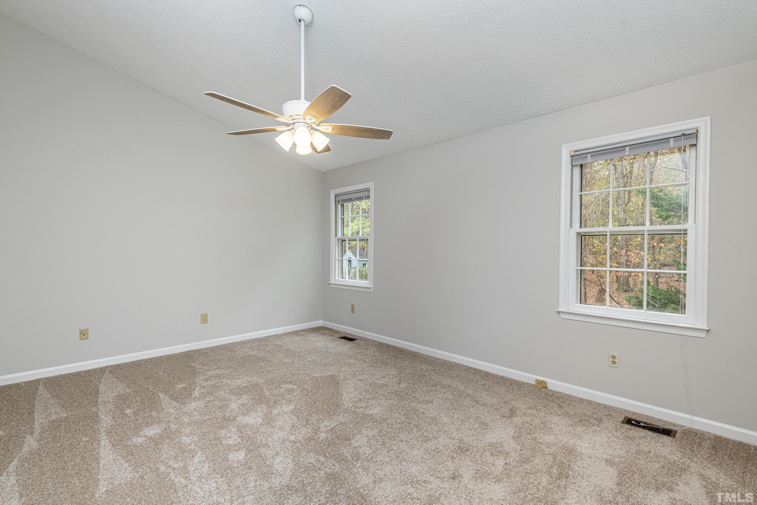 11913 North Exeter Way Raleigh, NC 27613 - Photo 19 of 29 a view of an empty room with a window