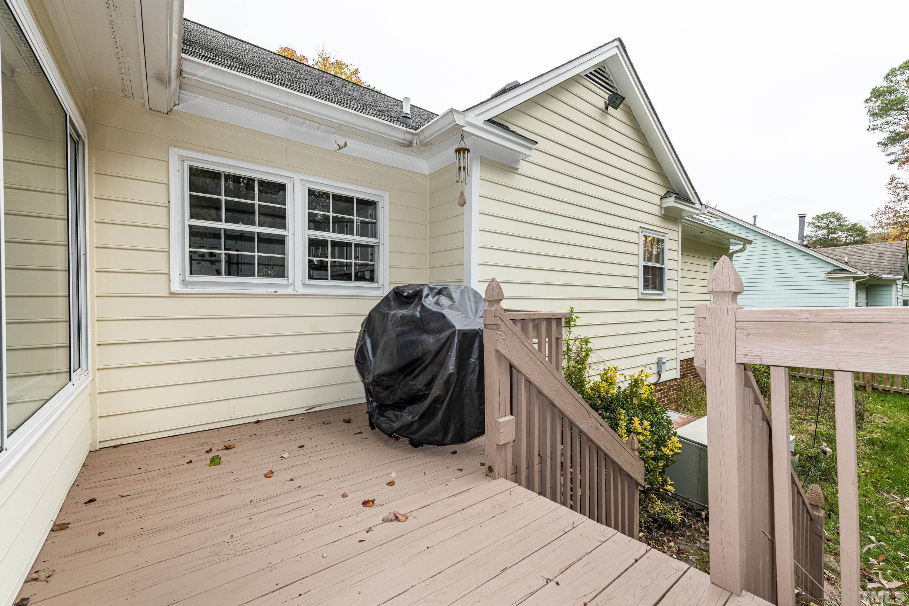 11913 North Exeter Way Raleigh, NC 27613 - Photo 26 of 29 a view of a house with a deck