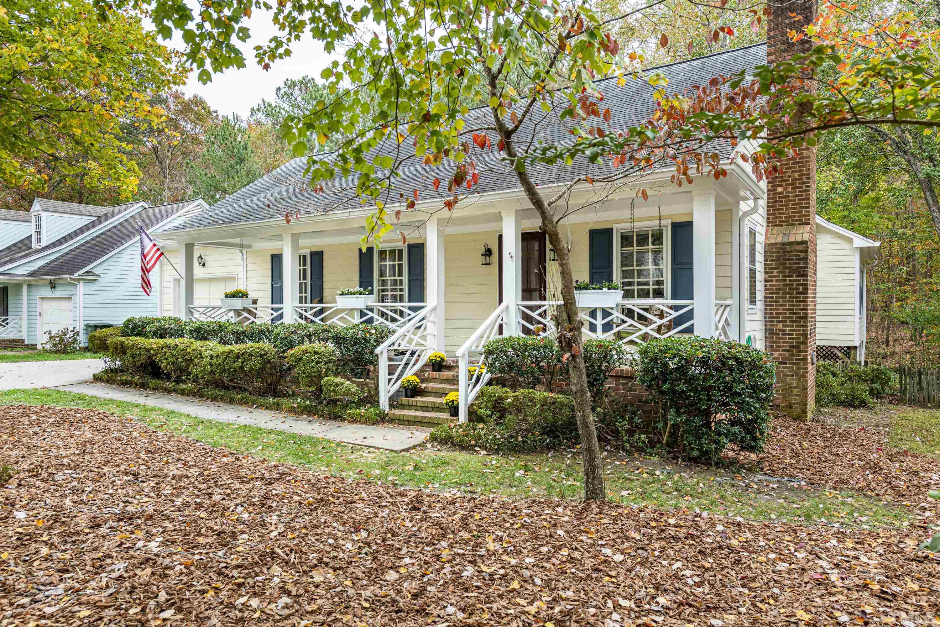 11913 North Exeter Way Raleigh, NC 27613 - Photo 3 of 29 a front view of a house with a garden