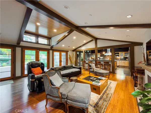 a room with lots of chairs and wooden floor