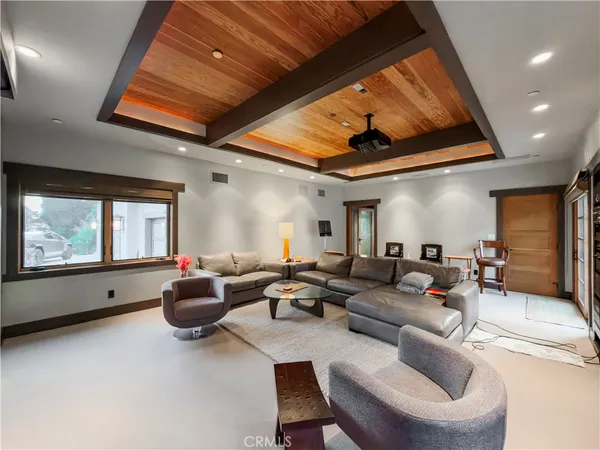 a living room with furniture a large window