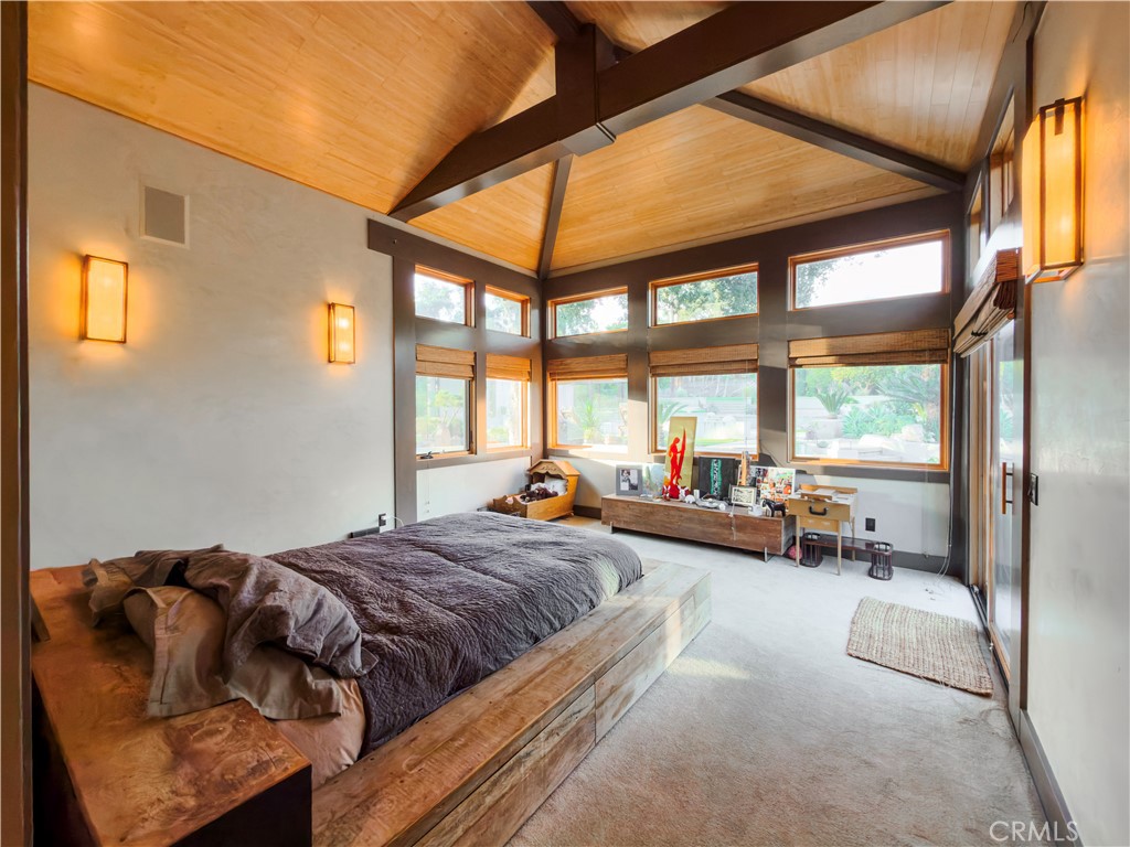 865 West Foothill Boulevard Arcadia, CA 91006 - Photo 24 of 44 a spacious bedroom with a bed and a large window