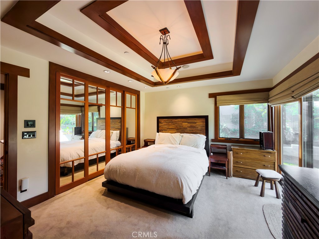 865 West Foothill Boulevard Arcadia, CA 91006 - Photo 31 of 44 a bedroom with a bed and a large window