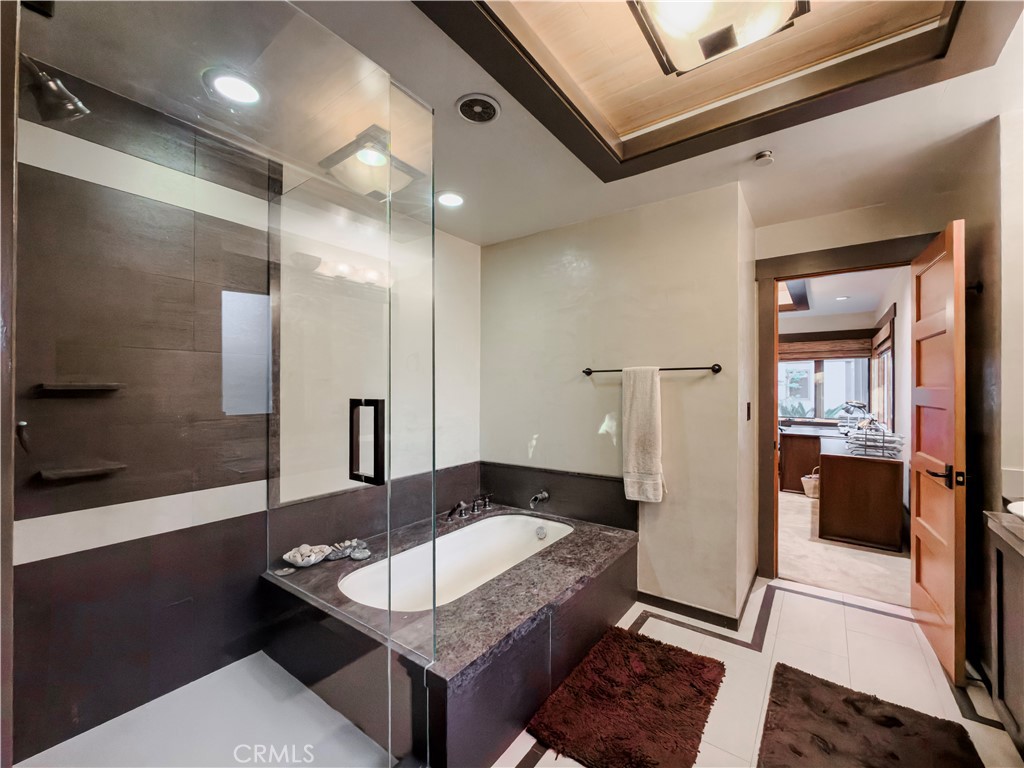 865 West Foothill Boulevard Arcadia, CA 91006 - Photo 32 of 44 a large bathroom with a tub and shower