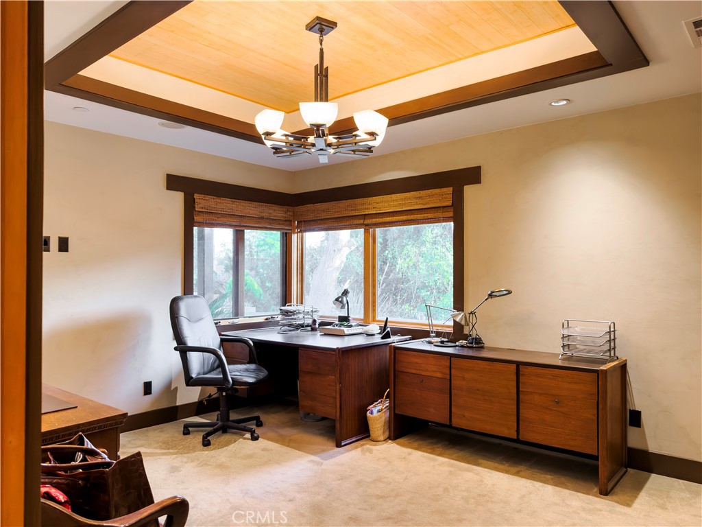 865 West Foothill Boulevard Arcadia, CA 91006 - Photo 34 of 44 a view of a workspace with furniture and a chandelier