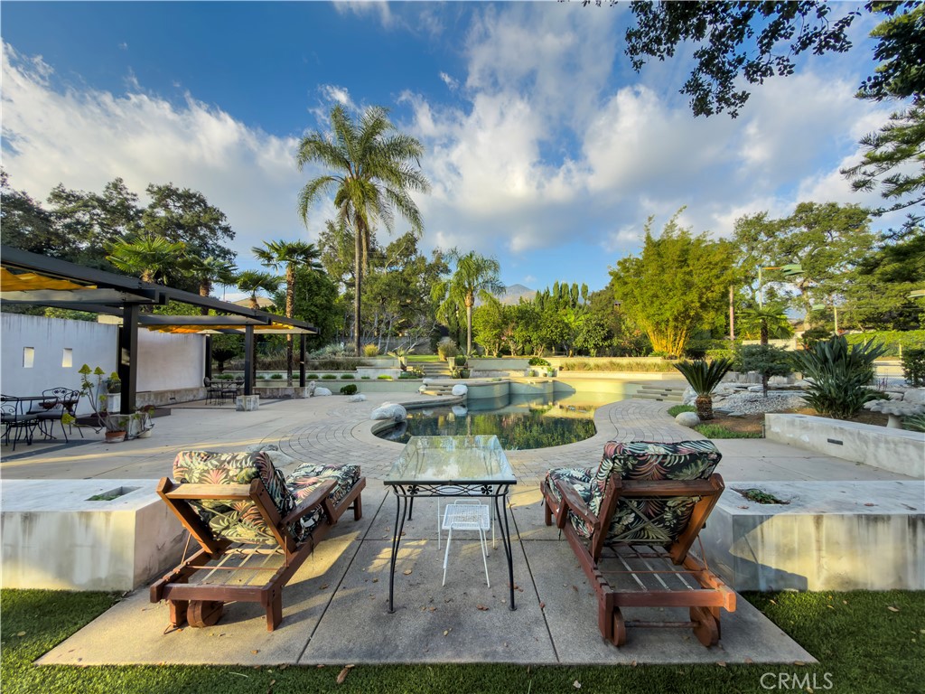 865 West Foothill Boulevard Arcadia, CA 91006 - Photo 41 of 44 a swimming pool with outdoor seating and yard