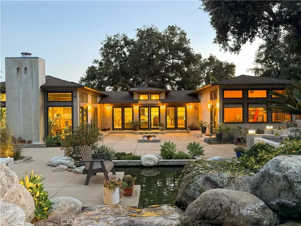 a living room filled with furniture and a large window